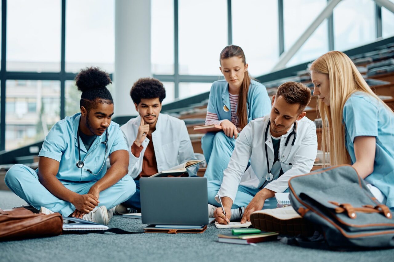 students of medicine using laptop while learning together in lecture hall at the university .jpg